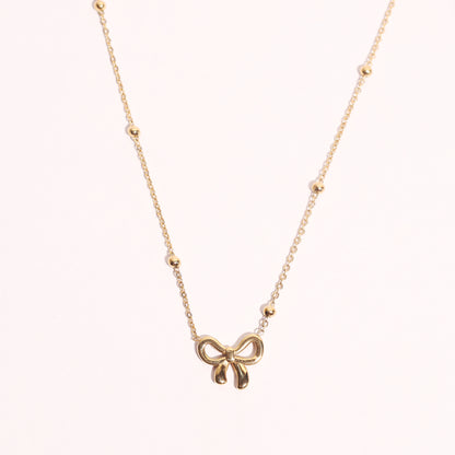 Stallae Golden Bow Pendant Necklace